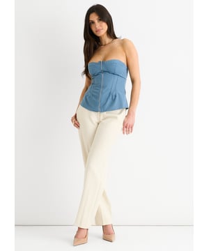 Upgrade your summer wardrobe with our Blue Seam Detail Bandeau Zip Front Top. Its bold blue color and unique zip front design make this top a standout piece. The seam detailing adds a touch of texture and elevates the look. Perfect for any occasion, this top is sure to make you feel confident and stylish.