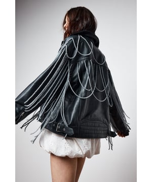 Genuine leather jacket with striking pearl trim detailing draped across the shoulders and back
        Classic biker silhouette with notched lapels and asymmetric zip fastening
        Decorative fringe trim cascading from the pearl embellishments for dramatic movement
        Functional side pockets and adjustable buckle detail at the hem
        Fully lined for comfort and ease of wear
    
    Make a bold statement with this Nasty Gal leather jacket that reimagines the classic biker style with eye-catching pearl trim detailing. The dramatic draping pearl chains and fringe create a captivating silhouette that demands attention, perfect for those who aren't afraid to stand out. Style it as seen with a floaty white mini dress and western-inspired boots for an edgy contrast that works brilliantly for nights out. For a more structured evening look, pair with a fitted bodycon dress and strappy heels. The versatile design allows for both rebellious and refined styling options, making it an ideal choice for everything from gigs and club nights to cocktail bars. This jacket doesn't just complete an outfit-it defines it, bringing undeniable character to your night-out wardrobe.