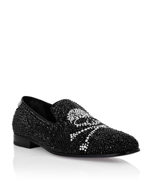 Evening loafers are the must-have garment for your elegance. Look at Plein’s revisited slip-on version. See how details make a difference.   Rhinestone-encrusted suede upper   Skull&Bones featured on the vamp   Grosgrain trim finish   Patent heel tab with metal Brand   Genuine leather sole   Logo hot-stamped on the outsole   Nappa lining   Diamond quilted satin footbed