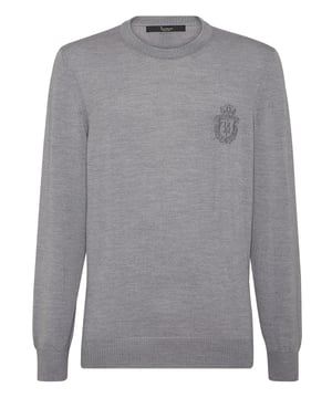 Explore new ways of expressing elegance with this season’s suggestions. Like this knit wool crewneck pullover. Look at the details.   12/14-gauge plain knit extrafine wool   Crest embroidered at left chest   The Brand initial embroidered on the hang loop sewn at yoke   Rib knit hems
