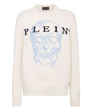 Jersey oversize de lana merina con la incrustación de la Calavera icónica de mohair. Letras de la marca están tejidas en jacquard. Cantos de punto de canalé.