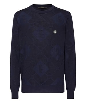 Explore new ways of expressing elegance with this season’s suggestions. Like this knit wool and silk crewneck pullover. Look at the details.  12/14-gauge jacquarded knit merino wool and silk  Leather patch with Crest sewn at left chest  The Brand initial embroidered on the hang loop sewn at yoke  Rib knit hems