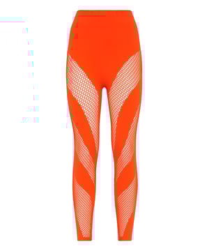 Celebre su sensualidad con estos leggings sin costuras con detalles distintivos.   Jersey superelástico sin costuras   Detalles de red   Recorte de la marca en la cintura   Costura a dos agujas