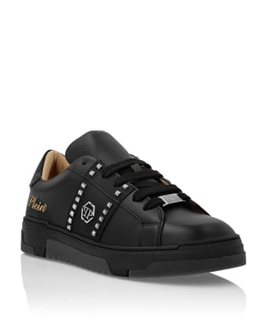 Discover the uniqueness of these lo-top sneakers with studs decoration. Look at the details.   Nappa upper    Rubber strap featuring studs and the nickel-plated logo   Contrasting colored heel tab   Nickel-plated spoiler on heel stabilizer   Hi-tech, ergonomic, ultra lightweight, shock-absorbing rubberized midsole   Grooved outsole for maximum grip   Padded nappa lining and removable insole