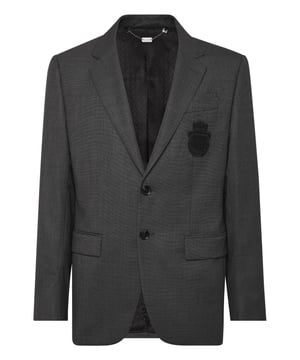 Un detalle es todo lo que necesita para marcar la diferencia. Eche un vistazo a este blazer de dos botones de tejido precioso y descubra los secretos de la elegancia.  Lana tejida ojo de perdiz  Parche con el escudo bordado en el pecho izquierdo  Botones con logotipo  Dos bolsillos con solapa  Una sola abertura de ventilación  Forro interior