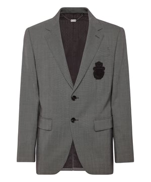 Un detalle es todo lo que necesita para marcar la diferencia. Eche un vistazo a este blazer de dos botones de tejido precioso y descubra los secretos de la elegancia.  Lana tejida ojo de perdiz  Parche con el escudo bordado en el pecho izquierdo  Botones con logotipo  Dos bolsillos con solapa  Una sola abertura de ventilación  Forro interior