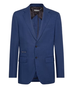La sencillez desmiente las reglas de la elegancia. Eche un vistazo a este blazer de lona de lana con dos botones y disfrute creando diferentes combinaciones.    Tejido de lana ligera    Dos bolsillos con solapa    Doble abertura    Medio forro