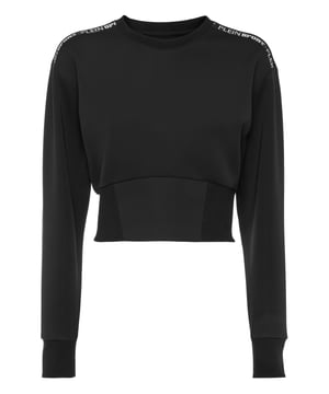 Trainiere und chille in vollem Komfort mit diesem Sweatshirt von Plein Sport.   Technisches Stretch-Fleece-Material   Markenschriftzug-Print an den Schultern   Gekürzte Passform   Rippstrick-Säume