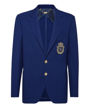 Gewebte Jacke aus Wolle mit zwei Knöpfen. Das ikonische Wappen ist auf der aufgenähten Brusttasche aufgestickt. Zwei aufgesetzte Taschen. Metallknöpfe. Figurbetonte Passform. Einzelner Schlitz. Ungefüttert.