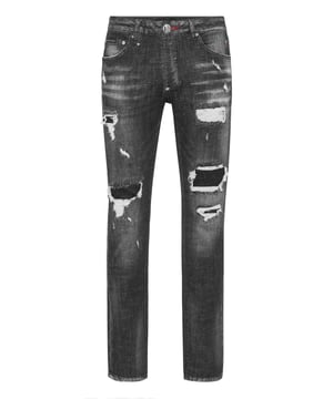 For your outfit we recommend these denim jeans with precious elements.                                                               Wear-and-tear denim   Rips mended with denim insets   Lettering embroidered on the back   Logo Patch sewn on the right rear pocket   Single metal button fastening   Fit: Super Straight