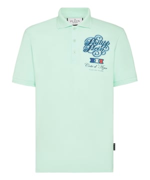 Discover the originality of this cotton piqué short sleeve polo shirt decorated with the Brand’s iconic elements.   Cotton piqué   Rhinestones application   Prints at left chest and back   Logoed patch sewn at yoke   Logoed buttons   Rib knit collar and cuffs    Two side slits