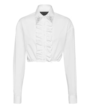 Añada una nota romántica a su conjunto con esta camisa crop de algodón y... Descubra más.    Popelín de algodón   Pedrería en las puntas del cuello   Tapeta fruncida   Bajo elástico   Botones con logotipo
