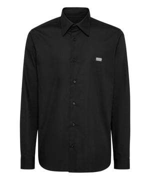 Add a whiff of uniqueness to your look with this cotton poplin shirt and... Find out what makes it one of a kind.   Cotton poplin   The iconic rhinestone Skull on the back    Metal logoed badge sewn at left chest   Logoed buttons   Curved hem   Fit: Sugar Daddy