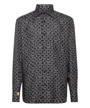 Revolutionize your elegance for special events with this print pure silk shirt. See the care for details.   All over print pure silk  Swarovski first button  Genuine mother-of-pearl logoed buttons   Collar: Capri  Rounded bottom  Fit: Regular Gold