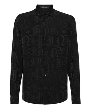 Verleihen Sie Ihrem Look einen Hauch von Einzigartigkeit mit diesem Hemd aus Baumwollpopeline und... Finden Sie heraus, was es einzigartig macht.   Jacquard-Baumwollpopeline, ganzflächig bedruckt   Strasssteine auf dem Rücken   Aufgenähte Metallplakette mit Logo auf der linken Brustseite   Knopfleiste mit Logo   Geschwungener Saum   Passform: Sugar Daddy