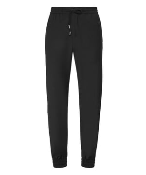 Descubre la originalidad de estos pantalones de jogging de lana con detalles especiales.   Lana ligera   Bolsillos con aberturas   Cintura elástica con cordón de ajuste   Puños elásticos.