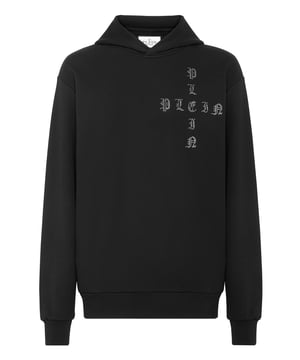 Sehen Sie, wie originell dieser Kapuzenpullover aus Baumwollfleece mit Applikationen ist.   Weicher Baumwollfleece   PP Sechseck auf einem saffianischen Lederschild, das auf der Kapuze aufgenäht ist   Marke mit Strass-Applikationen auf der linken Brust und auf dem Rücken   Zwei Eingrifftaschen   Rippstrickbündchen und unterer Saum   Passform: Over "