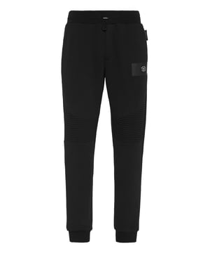 These joggers are the perfect match to achieve your goals. Comfort and performance add up to the style of Plein Sport.   Blend cotton fleece with contrasting colored elements   Stitching details   Tiger patch sewn on the fluorescent tape frame on left leg   Rib-knit waistband with drawstring   Two slit pockets   Loose fit for greater comfort   Rib knit bottom cuffs