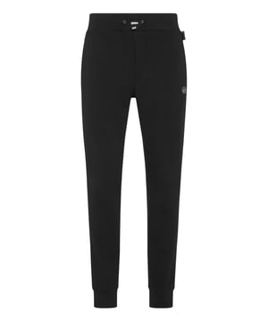 Descubra la originalidad de estos pantalones de chándal de forro polar de mezcla de algodón decorados con detalles únicos.   Tejido polar de mezcla de algodón   Inserciones de tejido con aplicaciones de cristal   Parche con logotipo   Bolsillos con aberturas   Cintura de canalé con cordón de ajuste de tope   Puños de punto elástico