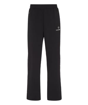 Estos pantalones de entrenamiento son el complemento perfecto para alcanzar tus objetivos. Comodidad y rendimiento se suman al estilo de Plein Sport.   Tejido técnico polar   Detalles Framis   Cintura ealstica   Estampado de letras en la pierna izquierda   Dos bolsillos con aberturas   Perneras con abertura lateral y botones a presión   Corte holgado para mayor comodidad   Costura a dos agujas