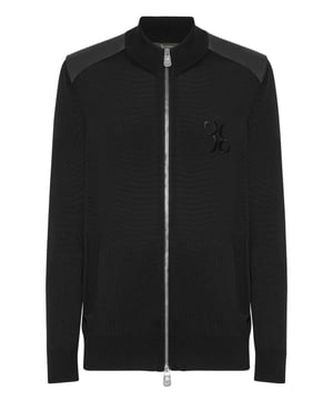 A touch of class for your leisure moments. See this merino wool and silk tracksuit with precious details.   Merino wool and silk    Leather appliqués and inserts   Monogram embroidered on top and bottom   Full zip top   Slit pockets on top and bottom   Stop-cord drawstring waistband   Rib knit hems