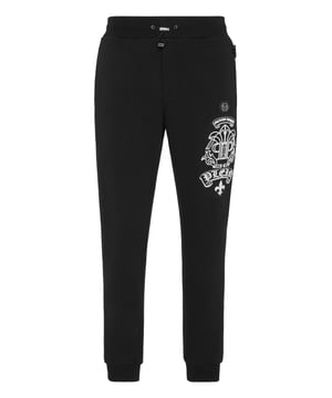 Discover the originality of these blend cotton fleece jogging pants decorated with unique details.   Blend cotton fleece   Pattern printed at left leg   Logoed patch   Slit pockets    Ribbed waistband with stop-cord drawstring   Rib knit cuffs
