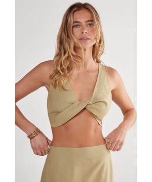 Chic twist-front design for a flattering silhouette
        Micro bralette style offers a trendy, minimalist look
        Sleeveless cut with wide straps for comfort and support
        Cropped length perfect for layering or wearing alone
        Versatile piece suitable for various casual occasions
    
    This NastyGal Twist Front Micro Bralette is the epitome of casual chic. The unique twist-front design adds a touch of intrigue to this otherwise simple piece, creating a flattering silhouette that's sure to turn heads. Perfect for those warm summer days or balmy nights out, this bralette can be styled in numerous ways to suit your mood and the occasion. Pair it with high-waisted trousers and a lightweight blazer for a smart-casual look, or team it with a flowing maxi skirt and sandals for a bohemian-inspired ensemble. The versatility of this piece makes it a must-have for any fashion-forward wardrobe. Whether you're heading to a family barbecue, a casual brunch with friends, or a relaxed evening out, this bralette will keep you looking effortlessly stylish. Remember to accessorise with delicate jewellery to complement the minimalist design of this trendy top.