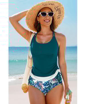 Our styles are designed with a trendy fitted look in mind following an international size standard. For the best fit we suggest choosing one size up from your usual. Be sure to check our sizing chart to find your perfect match!
  Color block design for the tankini top
  Strappy back and drawstring sides
  Matching floral print swim shorts
  Available in various colors and sizes
Material: 82% Polyamide 18% Elastane