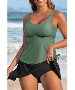 Our styles are designed with a trendy fitted look in mind following an international size standard. For the best fit we suggest choosing one size up from your usual. Be sure to check our sizing chart to find your perfect match!
  Mist Green Scoop Neck Adjustable Tankini and Matching Skort Bathing Suit
  2
  piece set: tankini top and skort bottom
  Padded cups for added support
  Adjustable straps for a customized fit
  Drawstring at the side for adjustable coverage
  Matching skort bottom with attached panties
  Available in solid color sets or mix
  and
  match styles
  High elasticity for a comfortable fit
Material: 82% Polyamide 18% Elastane