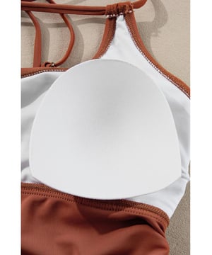 Our styles are designed with a trendy fitted look in mind following an international size standard. For the best fit we suggest choosing one size up from your usual. Be sure to check our sizing chart to find your perfect match!
  Color block design for the tankini top
  Strappy back and drawstring sides
  Matching floral print swim shorts
  Available in multiple colors and sizes
  High elasticity for a comfortable fit
Material: 82% Polyamide 18% Elastane