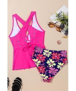 Our styles are designed with a trendy fitted look in mind following an international size standard. For the best fit we suggest choosing one size up from your usual. Be sure to check our sizing chart to find your perfect match!
  Floral tankini set for a fun and feminine look
  Flattering V
  neckline for added elegance
  Trendy crisscross back design for style and support
  Ruffled hem on the bottom for a playful touch
  Two
  piece set for versatile beach fashion
Material: 82% Polyamide 18% Elastane