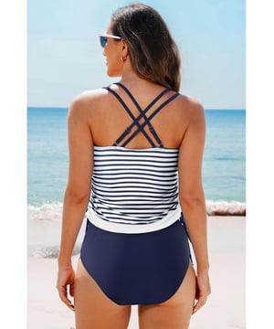 Our styles are designed with a trendy fitted look in mind following an international size standard. For the best fit we suggest choosing one size up from your usual. Be sure to check our sizing chart to find your perfect match!
  Color block design for the tankini top
  Strappy back
  Drawstring sides
  Includes floral print swim shorts
  Multiple color and size options available
Material: 82% Polyamide 18% Elastane