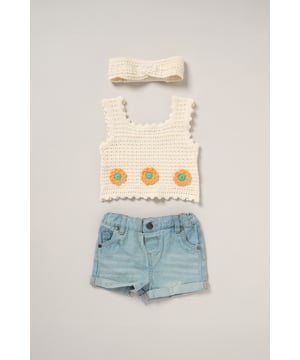 This adorable set by Miss includes a true knit top, denim shorts, and a matching headband. Perfect for warm days, it combines style and practicality, making it an ideal choice for playdates, outings, or casual summer looks.