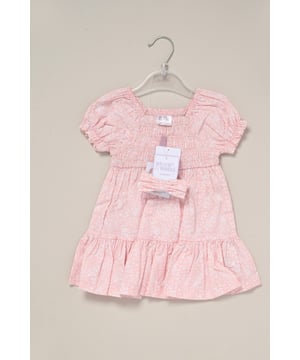 This printed summer dress and bow headband outfit set by Miss is the perfect addition to your little one’s summer wardrobe. The dress features tiered ruffles, cap sleeves, and a delicate floral print, creating a cute look perfect for sunny days, casual outings, or special occasions.