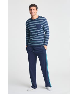 This Tokyo Laundry loungewear set feature a striped long-sleeve top paired with jersey trousers with contrast stripes. Designed for comfort and style, they offer a relaxed fit with an elasticated waistband and adjustable drawstring, making them ideal for lounging.