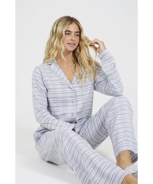 Unwind in style with this pyjama set from Brave Soul, the perfect blend of comfort and timeless charm. Made from 100% soft cotton, this set includes a long sleeve shirt and matching wide-leg trousers, both featuring an all-over classic check print. The trousers have an elasticated waist with adjustable drawcord, giving you a personalised, comfortable fit that's perfect for lounging or a great night’s sleep. Model wears UK size S.