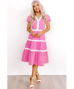 Our styles are designed with a trendy fitted look in mind following an international size standard. For the best fit we suggest choosing one size up from your usual. Be sure to check our sizing chart to find your perfect match!
  High waist dress for a defined silhouette
  Short puff sleeves for a charming feminine touch
  Flowy midi length for a graceful and versatile style
  Delicate ric rac trim detailing for a boho
  chic look
Material: 100% Cotton