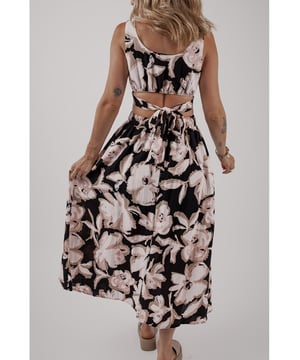 Black floral cutout maxi dress
  Square neck
  Sleeveless design
  Maxi length
  Knot back detail
  Flowy silhouette
Material: 100% Viscose