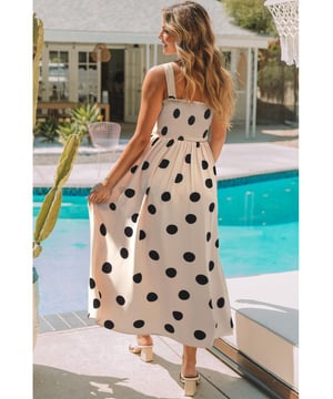 Elegant polka dot pattern
  Flattering silhouette with smocked bodice
  High waist design
  Flowy skirt for added grace
  Sleeveless for a flirty touch
  Ideal for pairing with layering necklaces and high heels
Material: 100% Polyester