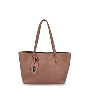 VINTAGE, RRP AS NEW
A treasure from Fendi's most artisanal line, this Fendi Selleria Small Mini Tote is a delicate testament to old-world craftsmanship. Handcrafted by the House's master saddlers, it belongs to a rare class of bags where luxury meets legacy. Rendered in soft pink 'Cuoio Romano' pebbled leather, it shimmers subtly with a light metallic finish, catching the light like a whispered secret.  The structured silhouette is balanced by double top handles and a smooth zip-top closure, while the interior reveals a luxe beige suede lining and a thoughtfully placed zip pocket. Inside, the presence of the 'Fendi Selleria' tag, serial number, and ity hologram quietly reaffirm its status as a piece of true craftsmanship.  Compact yet richly detailed, this mini tote isn't just a handbag-it's a work of art passed down from the hands of Fendi's finest. The Selleria line, steeped in tradition and known for its bespoke quality, continues to enchant collectors and connoisseurs with its understated elegance and timeless form. Condition Rating: A - EXCELLENTCondition Details: Gently used. Minimal wear of use on bottom corners. Please check the photos carefully and ask if you need to know more details or if you have any doubts.Measurements (cm):Depth: 8.9Height: 17.8Length: 26.7Other Details: Dustbag? YesKeys? NoBox? No Measurments:  width: 89 mm length: 267 mm height: 178 mm
