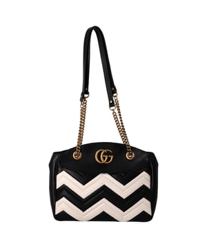 VINTAGE, RRP AS NEW
The Gucci GG Marmont Chevron Shoulder Bag in black and white leather is a striking blend of classic luxury and contemporary design, featuring the iconic GG logo and a bold chevron pattern for a timeless appeal. Crafted from premium leather, it offers durability and sophistication, making it perfect for both everyday wear and special occasions. Pair it with a simple blouse and tailored trousers for a chic, polished look, or wear it with a flowy dress for a more relaxed, stylish vibe. Complete the ensemble with gold jewelry to complement the bag's luxurious accents and elevate your outfit.

 Gucci GG Marmont Chevron Shoulder Bag in Black and White Leather

Condition: Excellent
Signs of wear: No retail tag, No visible sign of wear., 
Packaging: Dust bag
Color: Black
Material: Leather | leather
Size: One Size | One Size
Measurements: Width: 90; Height: 240; Length: 360; Handle drop: 0; Strap length: 680
SKU: NAPPUDEBA464493W