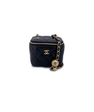 VINTAGE, RRP AS NEW
This beautiful Bag will come with a Certificate of ity provided by Entrupy. The certificate will be provided at no further cost  Introducing the coveted Chanel Mini Vanity Case with Chain Bag, a true showstopper designed in 2019. This petite carrier draws inspiration from the iconic shape of Chanel's vanity cases, offering a fresh yet timeless design. Crafted in classic black quilted caviar leather, the bag is adorned with the signature goldtone CC logo on the front, exuding elegance and luxury. The diamond quilting of the leather elevates its sophisticated look and texture.  The gold metal hardware Condition Rating: A - EXCELLENTCondition Details: Gently used. Chanel dustbag and card included. Please, see the photos and/or ask if you have any doubts or if you need more information.Measurements (cm):Depth: 6.4Height: 8.9Length: 10.2Other Details: Dustbag? YesKeys? NoBox? No Measurments:  width: 64 mm length: 102 mm height: 89 mm