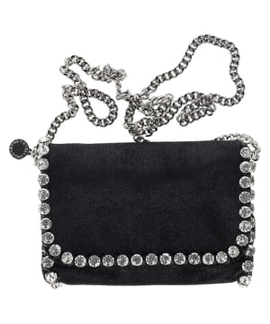 VINTAGE, RRP AS NEW
The Stella McCartney Mini Falabella Crossbody Bag in Black Shaggy Deer exudes effortless sophistication, featuring the brand's signature chain trim and a luxurious, vegan-friendly Shaggy Deer material. Compact yet functional, this bag offers a stylish way to carry your essentials, with its sleek black hue making it versatile for various occasions. The unique texture of the Shaggy Deer fabric adds a modern, eco-conscious twist to a classic design. Style it with a tailored blazer and skinny jeans for an edgy, chic look, or pair it with a simple dress to elevate your evening ensemble.

 Stella Mccartney Mini Falabella Crossbody Bag in Black Shaggy Deer 

Condition: Excellent
Signs of wear: No retail tag, No visible sign of wear., 
Packaging: Dust bag
Color: Black
Material: Leather
Size: One Size | One Size
Measurements: Width: 40; Height: 140; Length: 200
SKU: NAPPUGBBA464975W