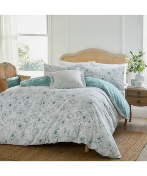Transform your bedroom into a serene haven with the Bella Duvet Cover Set. Designed with a dainty floral motif in soothing tones, it brings an effortless elegance to any décor style. Crafted from a premium cotton blend, its 180 thread count reverse ensures long-lasting comfort, combining a soft touch with excellent durability for restful nights. The reversible design offers two stunning prints in one, letting you refresh your room’s look with ease. This duvet cover set blends beauty and practicality to elevate your space effortlessly.
