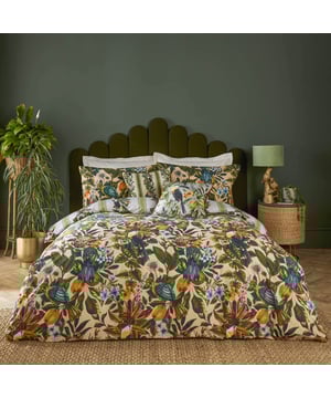 Transform your bedroom into an exotic sanctuary with the Leilani Duvet Cover Set. Crafted from a cotton blend fabric with a 180 thread count, this set offers both comfort and style. Each piece showcases a vibrant tapestry of tropical flora, fauna, and fruit, immersing you in a lush rainforest ambiance. Marvel at the songbirds amidst blooming foliage, where warm tones of blush and coral interplay with energetic teals and vivid oranges. Perfect for those who appreciate bold yet elegant decor, this set promises to express your unique personality and impress your guests.