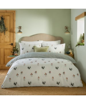 Wintery nights just got cosier with the Robin's Return Brushed Cotton Duvet Cover Set. Featuring delicate handpainted motifs inspired by the natural world, this set seamlessly blends charming woodland patterns with timeless sophistication. Crafted from the softest brushed cotton and paired with a sophisticated stripe, this duvet cover and pillowcase set bring both cosy comfort and charming style to your home. Created for those who love nature-inspired prints and modern country interiors, this bedding brings warmth, comfort, and seasonal charm to your home.