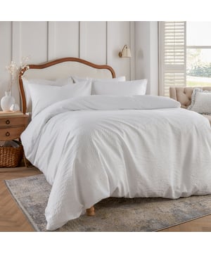 Elevate your bedroom with the Georgia Duvet Cover Set, a perfect blend of elegance and comfort. Showcasing heat-pressed detailing inspired by the natural world, its intricate design adds depth and sophistication to your space. Soft to the touch and effortlessly timeless, this set enhances your room’s aesthetic while providing a luxurious feel for restful nights. Thoughtfully crafted with durable, quality materials and finished with a secure button closure, it offers a harmonious balance of style and practicality, catering to those who value both beauty and function.
