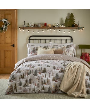 Transform your bedroom into a whimsical retreat this festive season with the Forest Festivities Printed Duvet Cover Set. Crafted from a soft and durable fabric blend, this reversible design features an enchanting woodland scene where charming forest animals come alive to celebrate the magic of Christmas. From delicate details of leaping hares to nestled rabbits, every inch evokes a storybook wonder that captures the festive spirit. Perfectly balanced with a simple spotted reverse, this bedding achieves both a playful and sophisticated winter charm. Elevate your space and impress your guests with a touch of seasonal enchantment, all while enjoying exceptional value.