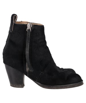 VINTAGE, RRP AS NEW
 The Acne Studios Zipped Ankle Boots in black pony hair offer a luxurious and edgy take on a classic silhouette, combining premium materials with a sleek design. The soft, textured pony hair adds a unique, tactile element, while the zip closure ensures a secure and stylish fit. Pair these boots with skinny jeans and an oversized sweater for a chic, casual look, or style them with a midi skirt for a fashion-forward contrast. The timeless black color and modern finish make these ankle boots a versatile statement piece that will elevate any outfit.

Acne Studios Zipped Ankle Boots in Black Pony Hair

Condition: Very good
Signs of wear: Minor markings, Lightly used but very well maintained. Minor mark at soles & creasing, light scuffing at the soles and heels.
Packaging: Dust bag
Color: Black
Material: Pony hair
Size: IT | 35
Measurements: Heel height: 70; Insole length: 270
SKU: NAPPUGBSH464767W