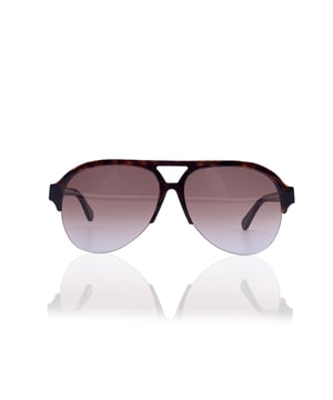VINTAGE, RRP AS NEW
A modern icon with vintage soul, these Stella McCartney 'Falabella' aviator sunglasses (mod. SC0030S - c.002) echo the glamour of classic design with a fiercely contemporary conscience. Made in Italy and crafted from innovative bio-based materials, the half-rim brown frame blends sustainability with style, making them as forward-thinking as they are timeless.  The gradient brown lenses cast the world in warm, sepia tones, while the signature gold metal chain-gracefully draped along the upper rim-pays homage to the house's iconic Falabella line. With dimensions of 57/14 - 145, this piece is both statement and staple, poised between runway boldness and everyday elegance.  For the collector, the dreamer, or the effortlessly cool-these are sunglasses with a story, and yours is the next chapter. Condition Rating: A - EXCELLENTCondition Details: Gently Used. Lenses and frame in excellent condition. Please check the images carefully. Some show arrows indicating any evident defect. Please ask if you need to know more details or if you have any doubts. Glasses maximum Width: 140mm Glasses Temple 145mm Glasses maximum lens width: 57mm Glasses maximum lens 54mm Glasses bridge width: 14mm Measurments:  width: 140 mm